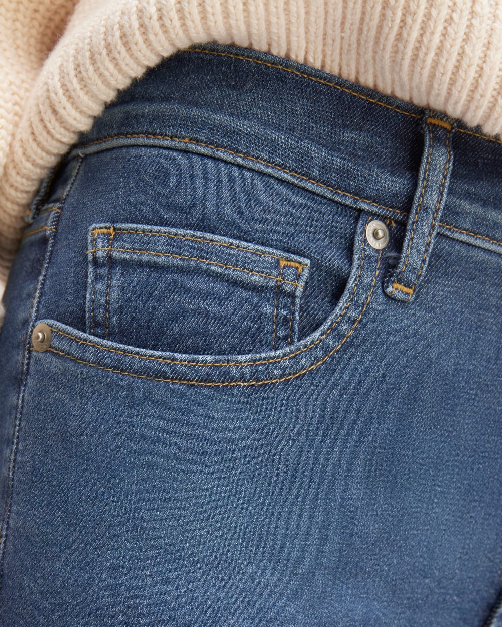 The Kick Bootcut Jean in Dark Indigo Blue — detail view