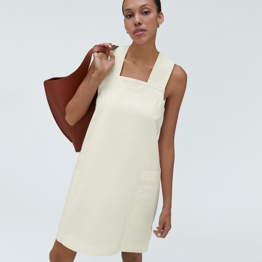 The Cross-Back Apron Mini Dress in Canvas — detail view