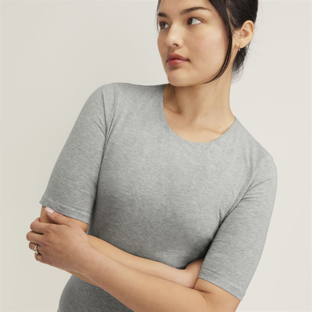 The Short-Sleeve Crew Neck Bodysuit in Heathered Grey — detail view