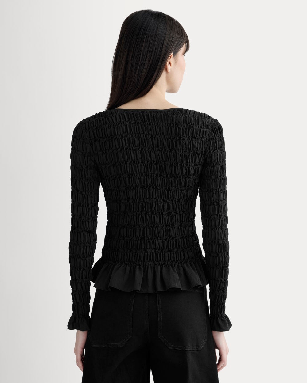 The Smocked Cardigan in Black — detail view