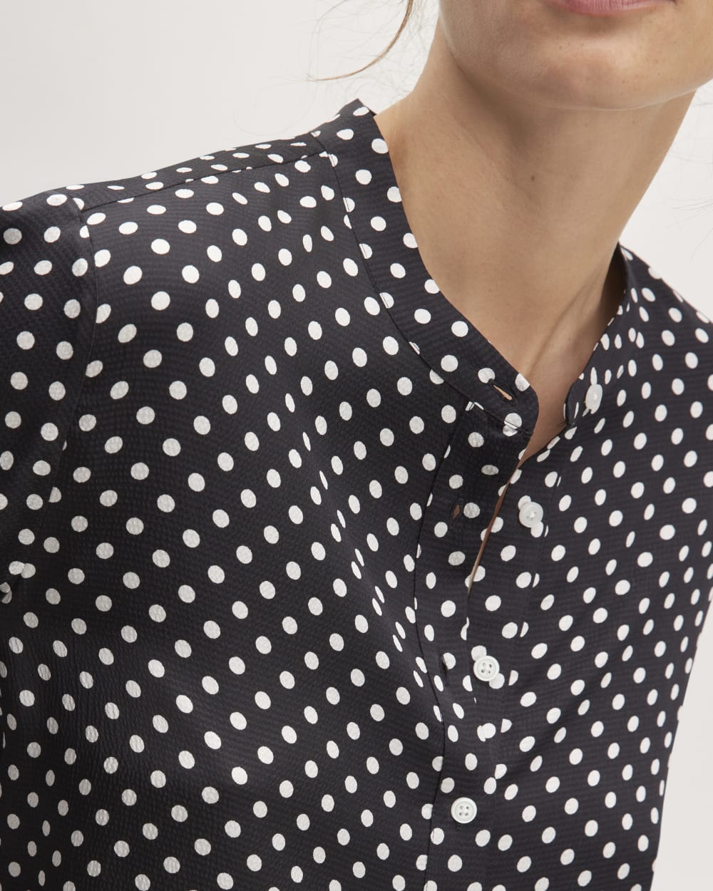 The Hammered Satin Popover Shirt in Black / Bone Polka Dot — detail view