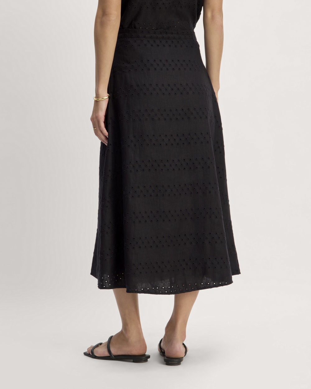 The Linen Eyelet Midi Skirt in Black Eyelet — detail view