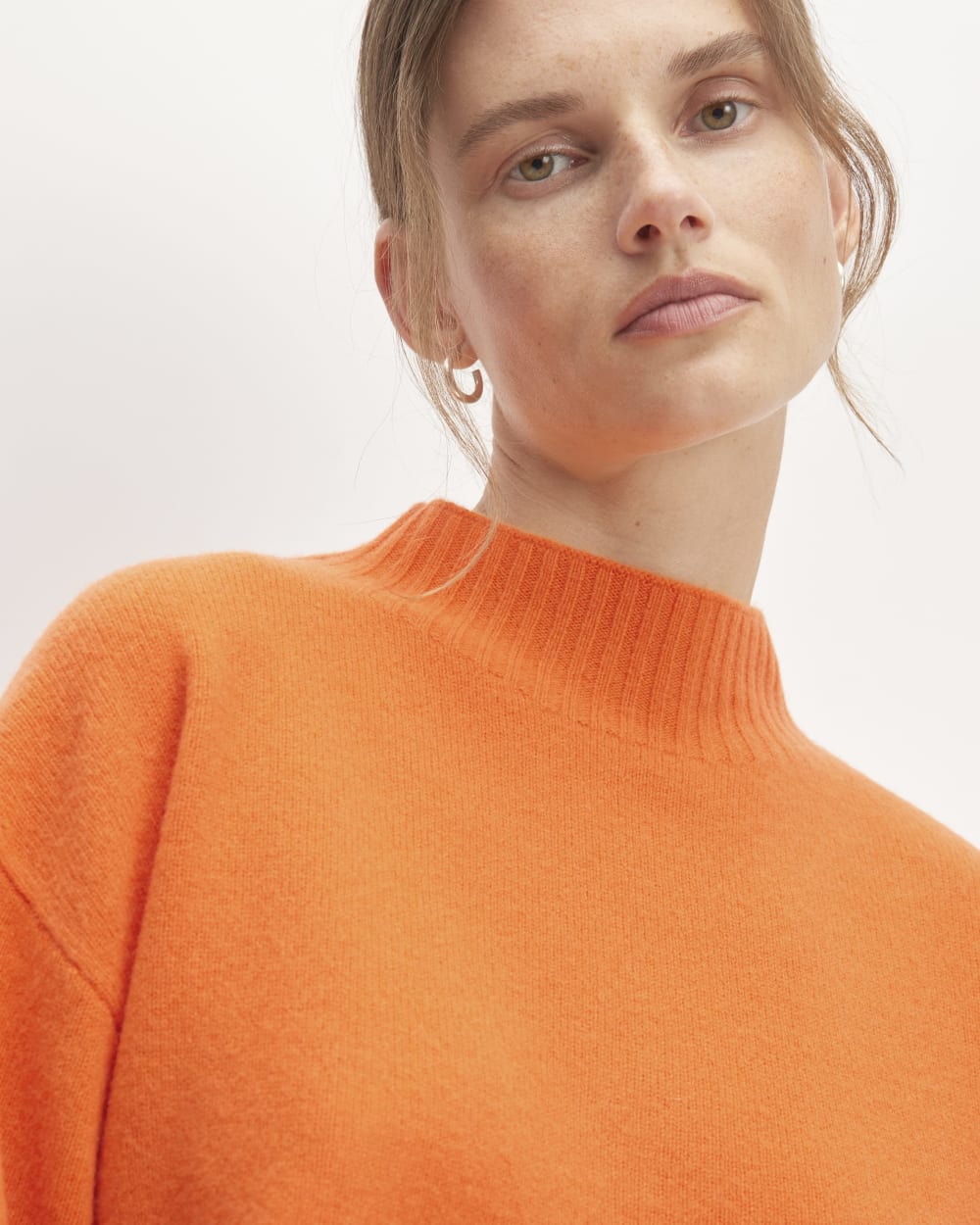 The Good Merino Wool Mockneck Sweater in Orange — detail view