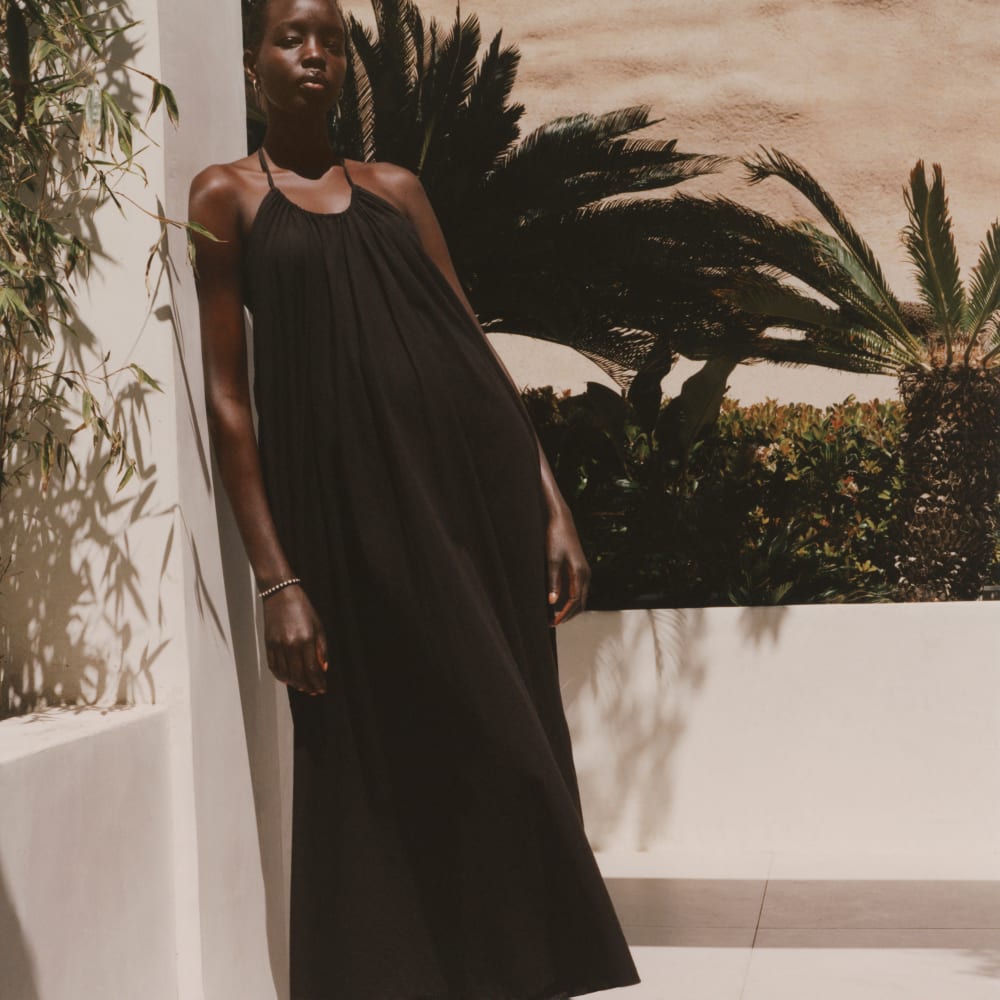 The Tie-Back Halter Dress in Black — detail view