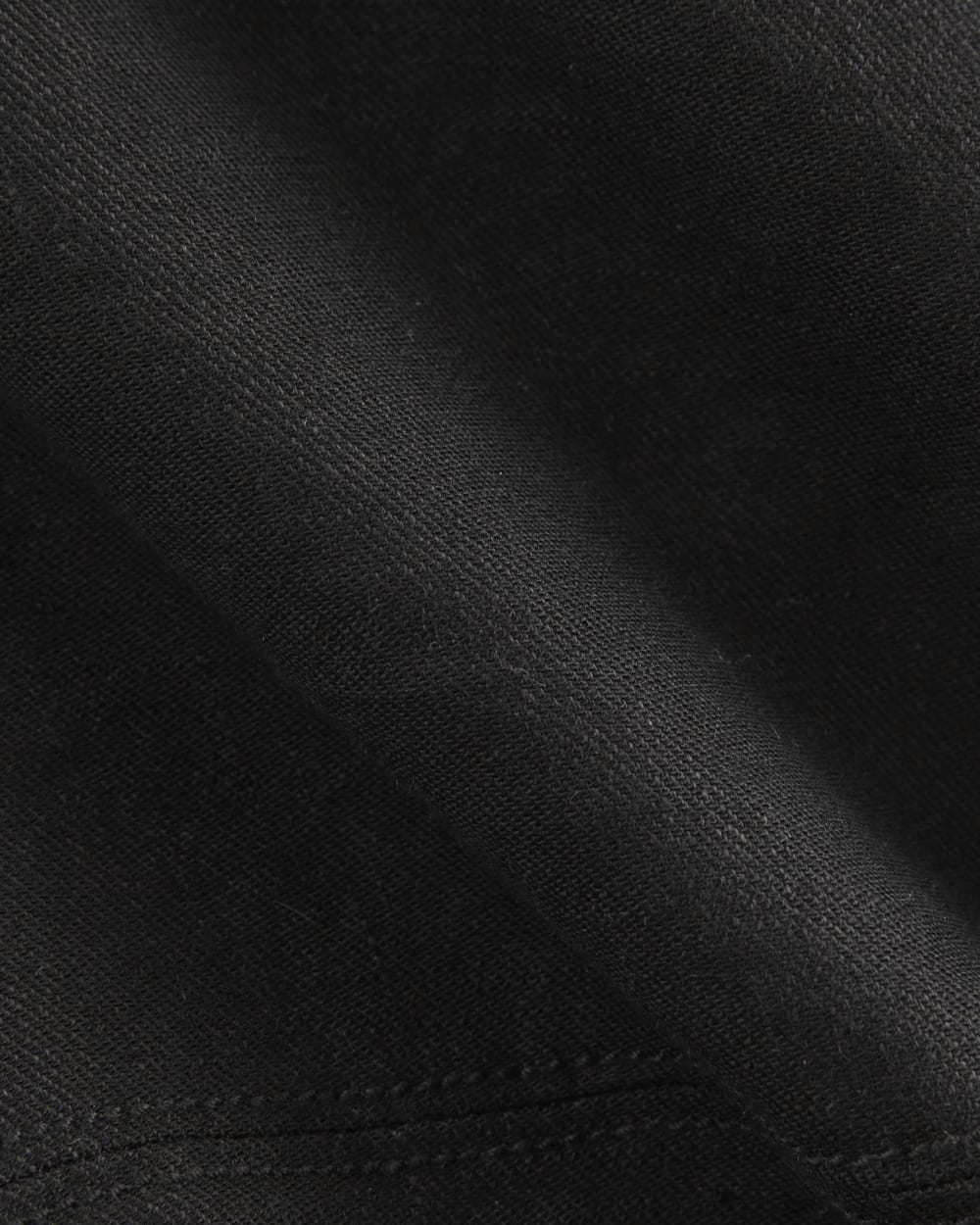 The Mini Skirt in Stretch Linen in Black — detail view
