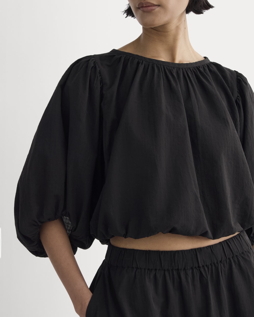 The Gauze Puff-Sleeve Top in Black — detail view
