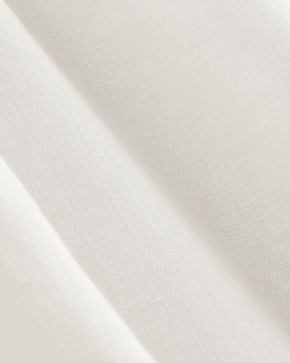 The Henley Shirt in Linen in White — detail view