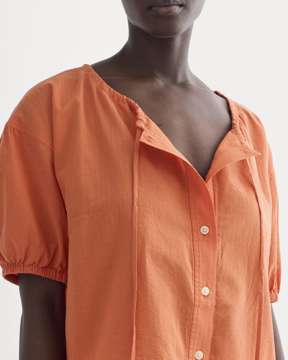 The Gauze Button-Up in Soft Orange — detail view