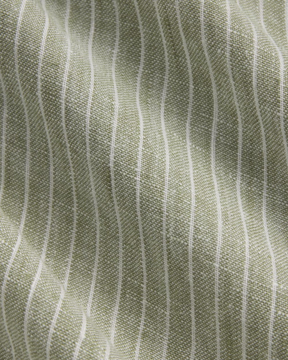 The Popover Dress in Linen in Oil Green / White — detail view