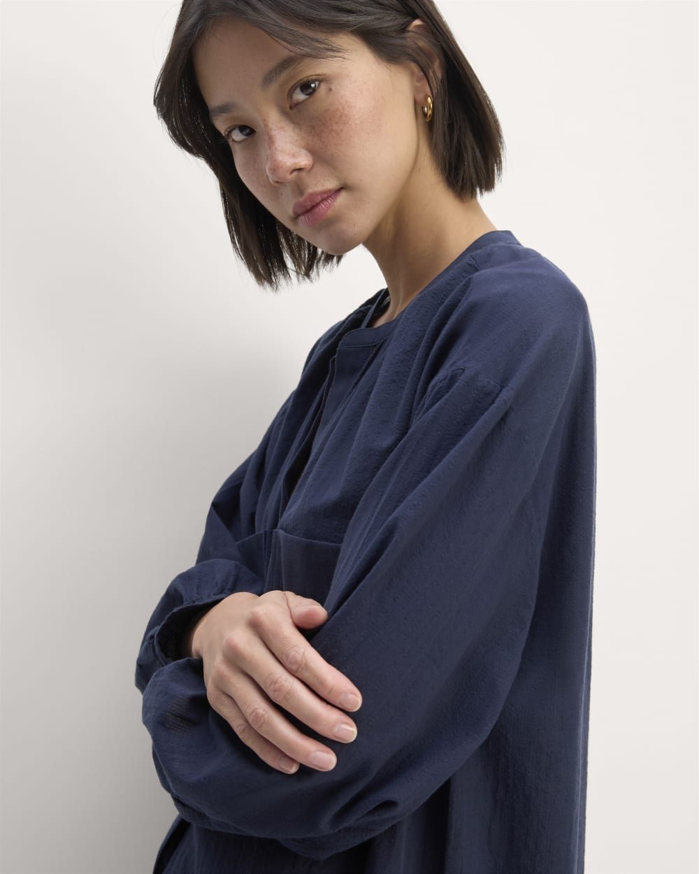 The Gauze Caftan Dress in Navy — detail view