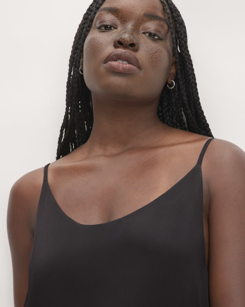 The Hammered Satin Slip Dress in Black — detail view