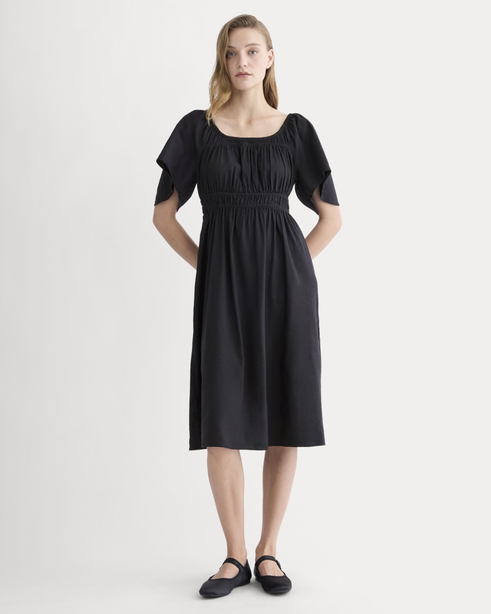 The Flutter-Sleeve Dress in Stretch Linen in Black — front view
