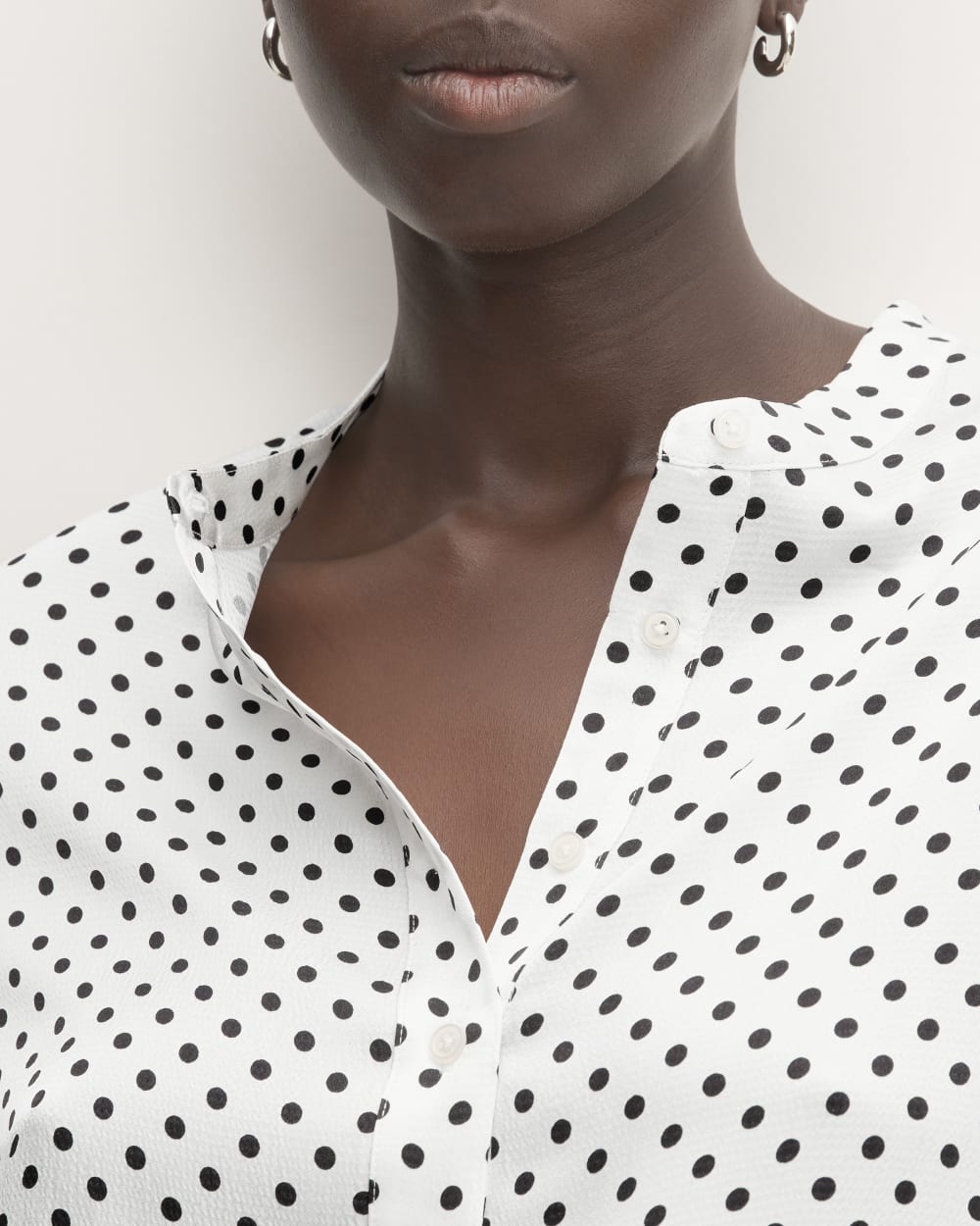 The Hammered Satin Popover Shirt in Bone / Black Polka Dot — detail view