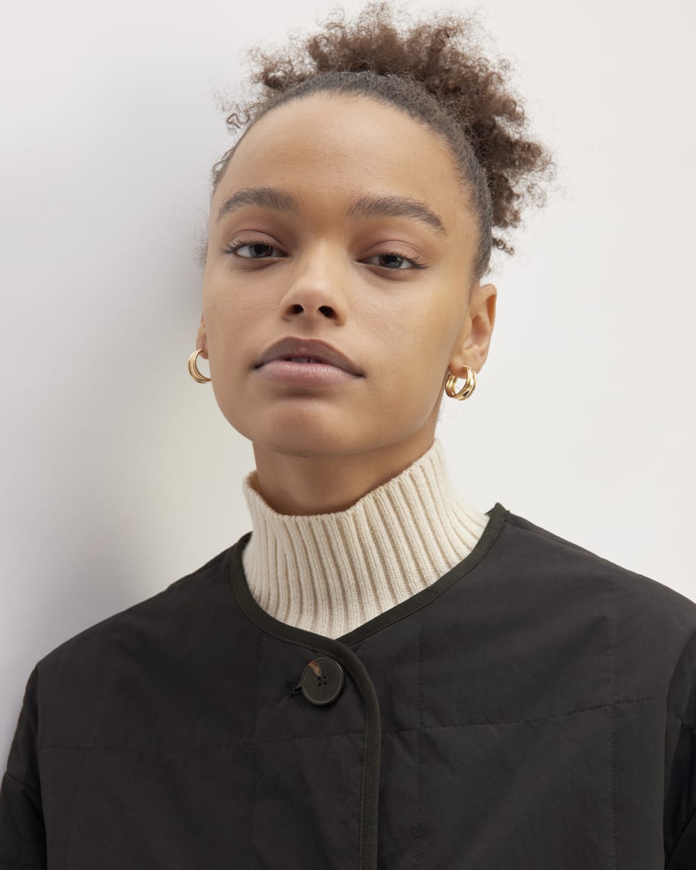 The ReNew Quilted Long Liner in Black — detail view