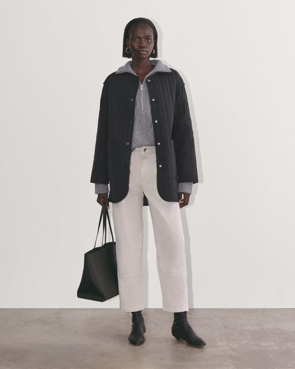 The Midi Quilted Liner in Black — detail view