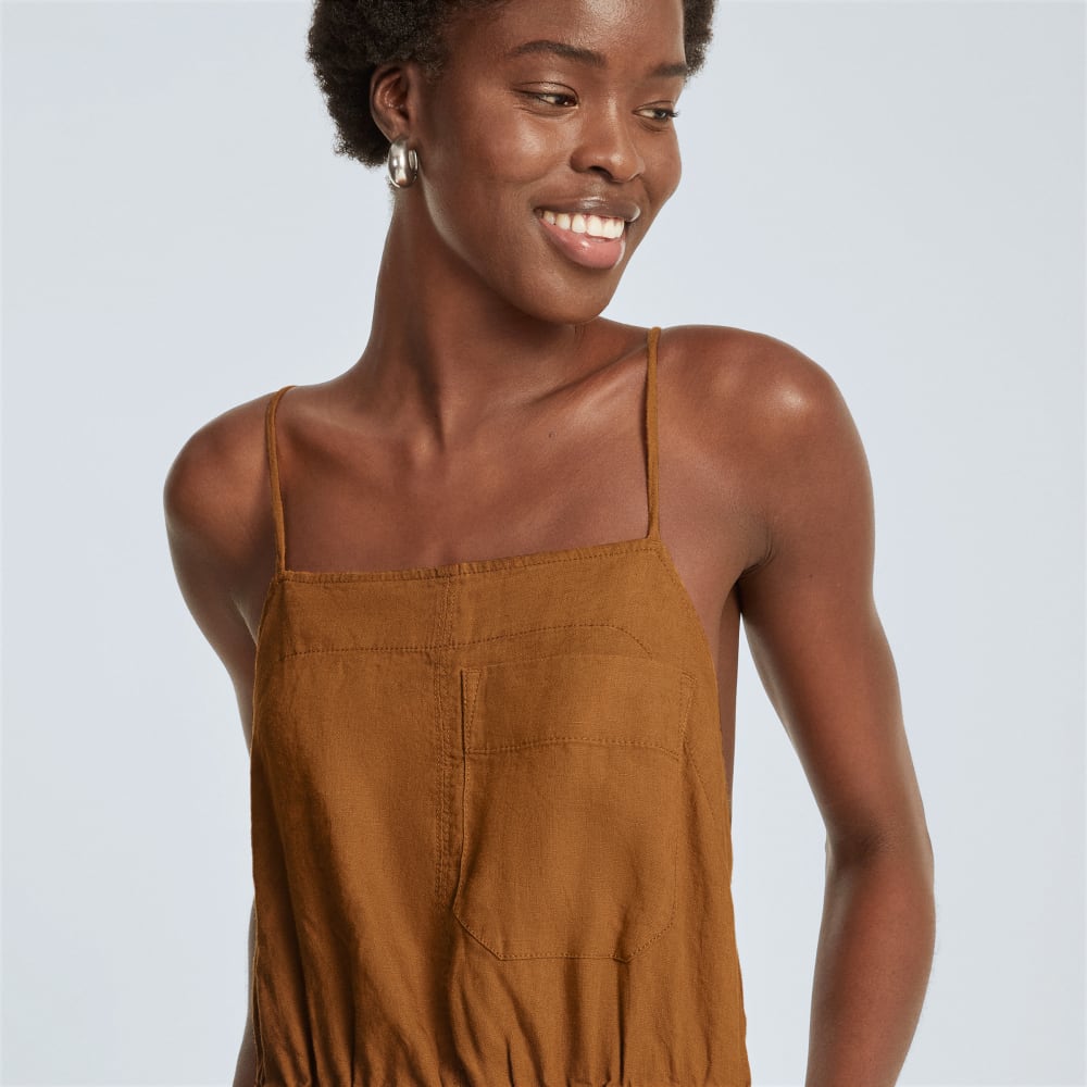 The Linen Shoestring Jumpsuit in Tawny Brown — detail view
