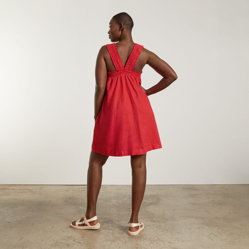 The Smocked Linen Dress in Goji Berry — detail view