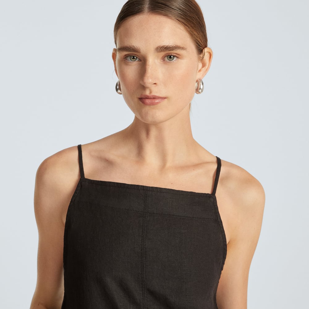 The Linen Apron Dress in Black — detail view