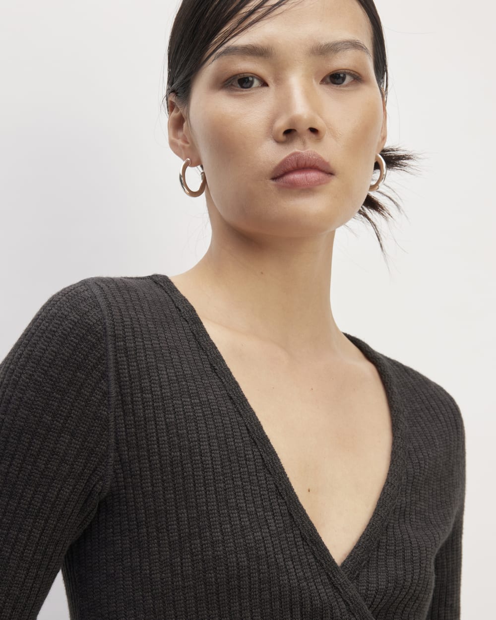 The Cozy Rib Wrap Top in Black — detail view