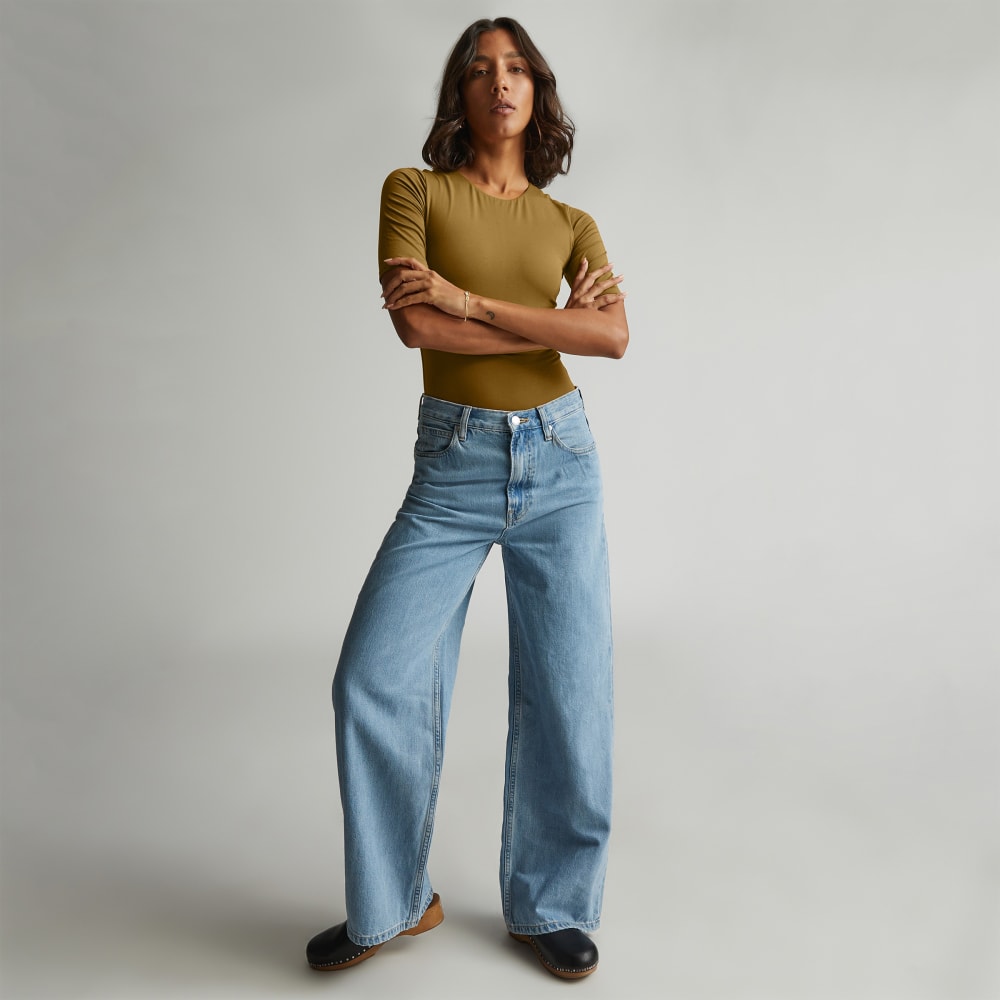 The Short-Sleeve Crew Neck Bodysuit in Tapenade — detail view