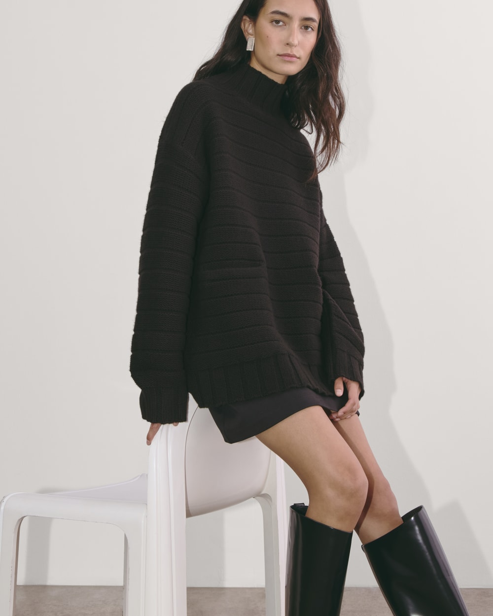 The Oversized Turtleneck in Luxe Merino in Black — detail view