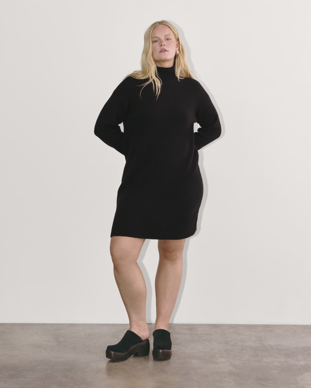 The Sweater Dress in Plush Cotton in Black — front view