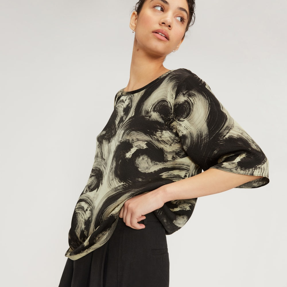 The Satin Relaxed Tee in Pale Yellow / Black — detail view