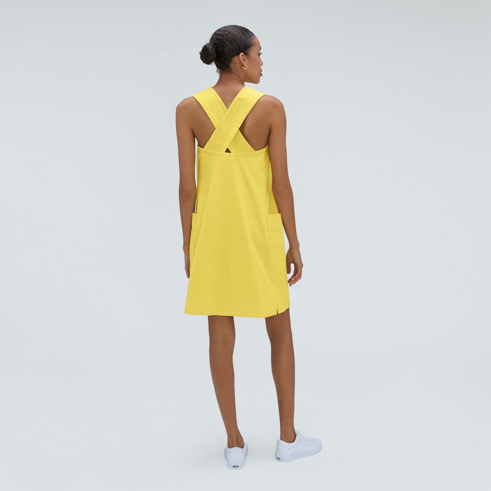 The Cross-Back Apron Mini Dress in Lemon — detail view