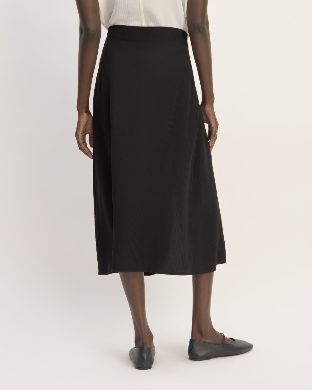 The Mini Jacquard Stripe Slip Skirt in Black — detail view
