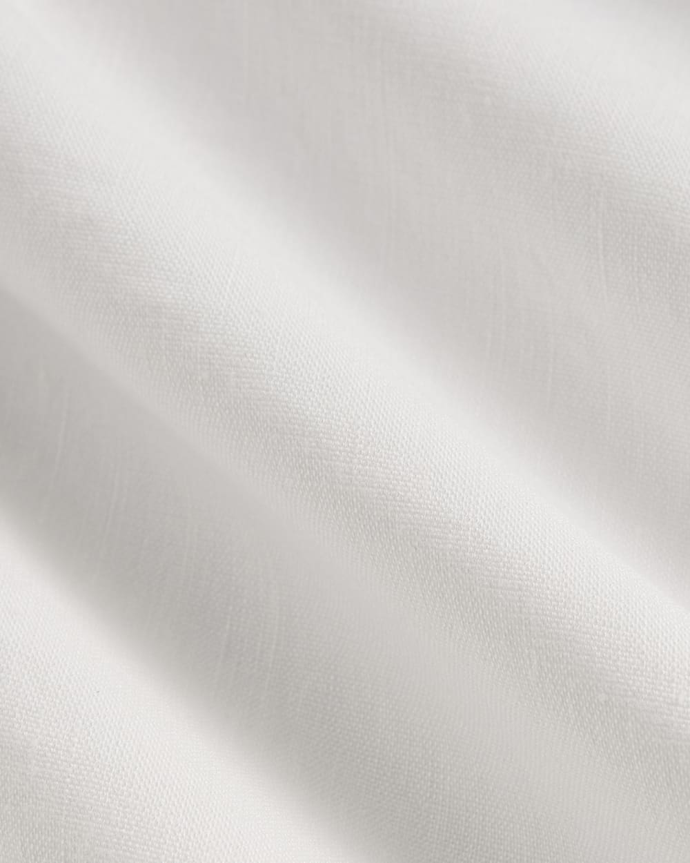 The Shift Dress in Stretch Linen in White — detail view