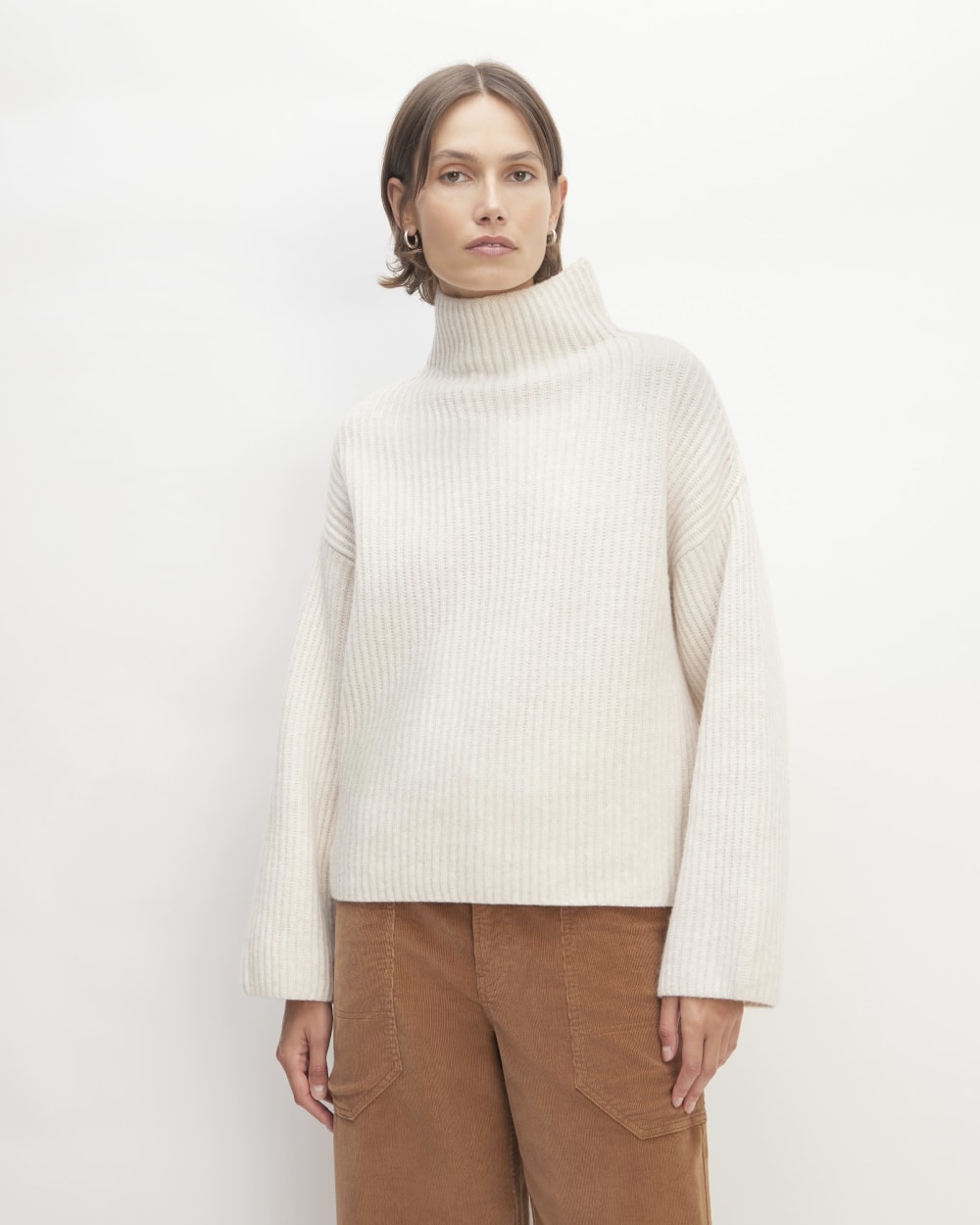 The Felted Merino Funnel-Neck Pullover in Heathered Oat — front view