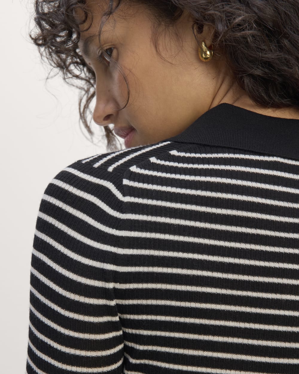 The Polo in Ultrasoft Merino in Black / Bone — detail view