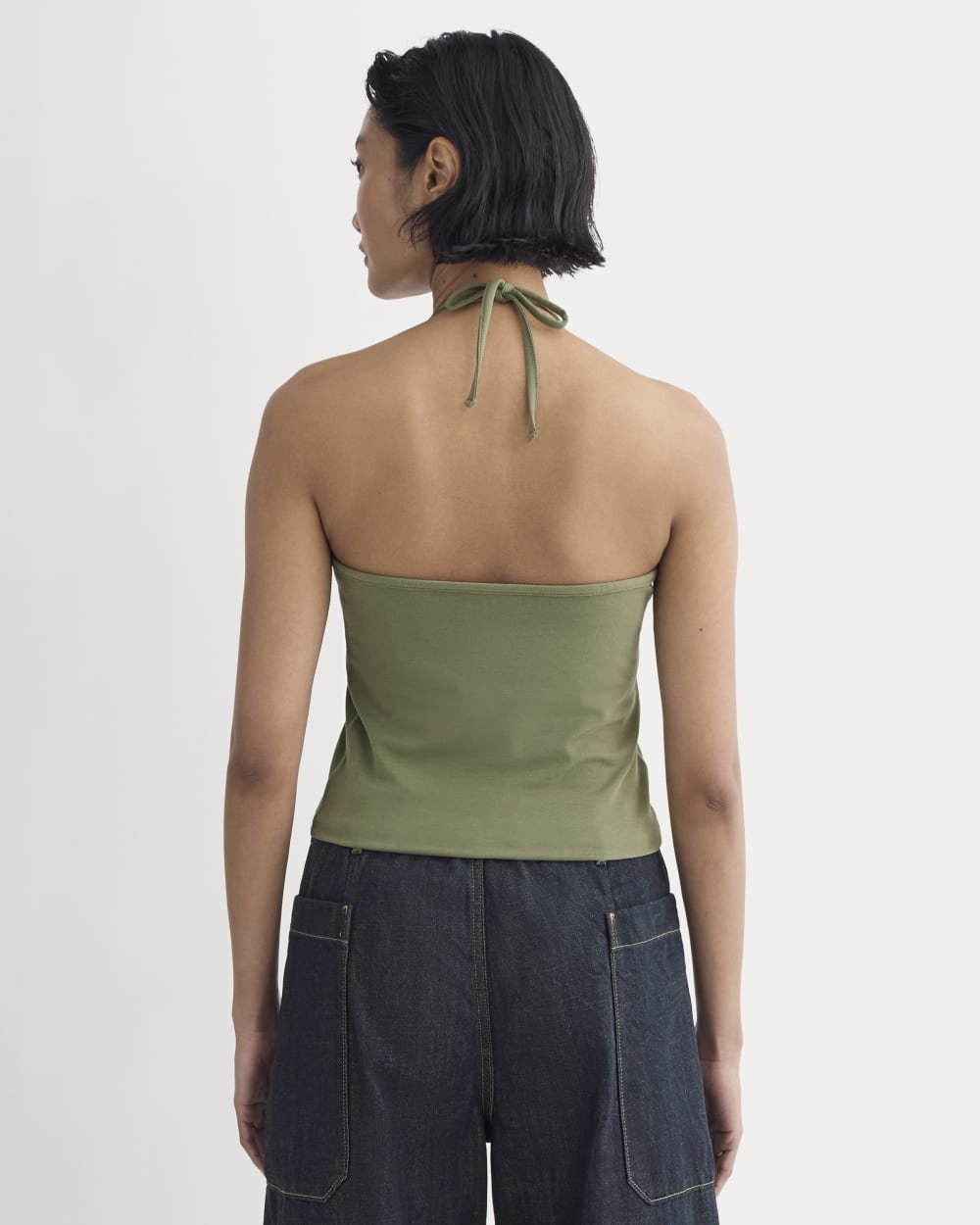 The Form Halter Top in Lichen Green — detail view