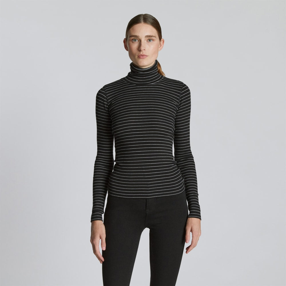 The Luxe Rib Turtleneck in Black / Canvas Tan — front view