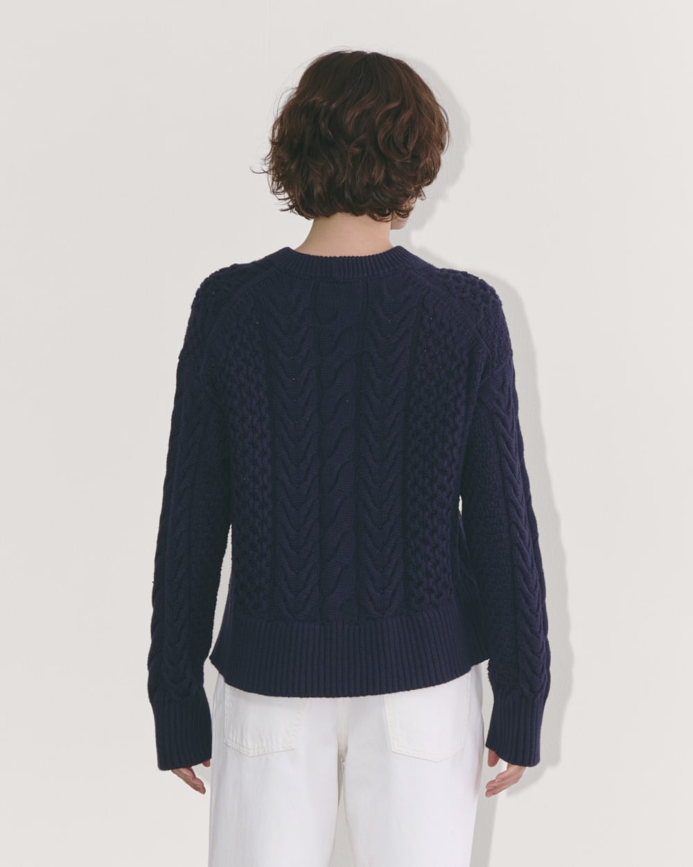 The Cable Sweater in Everyday Cotton in Navy — detail view