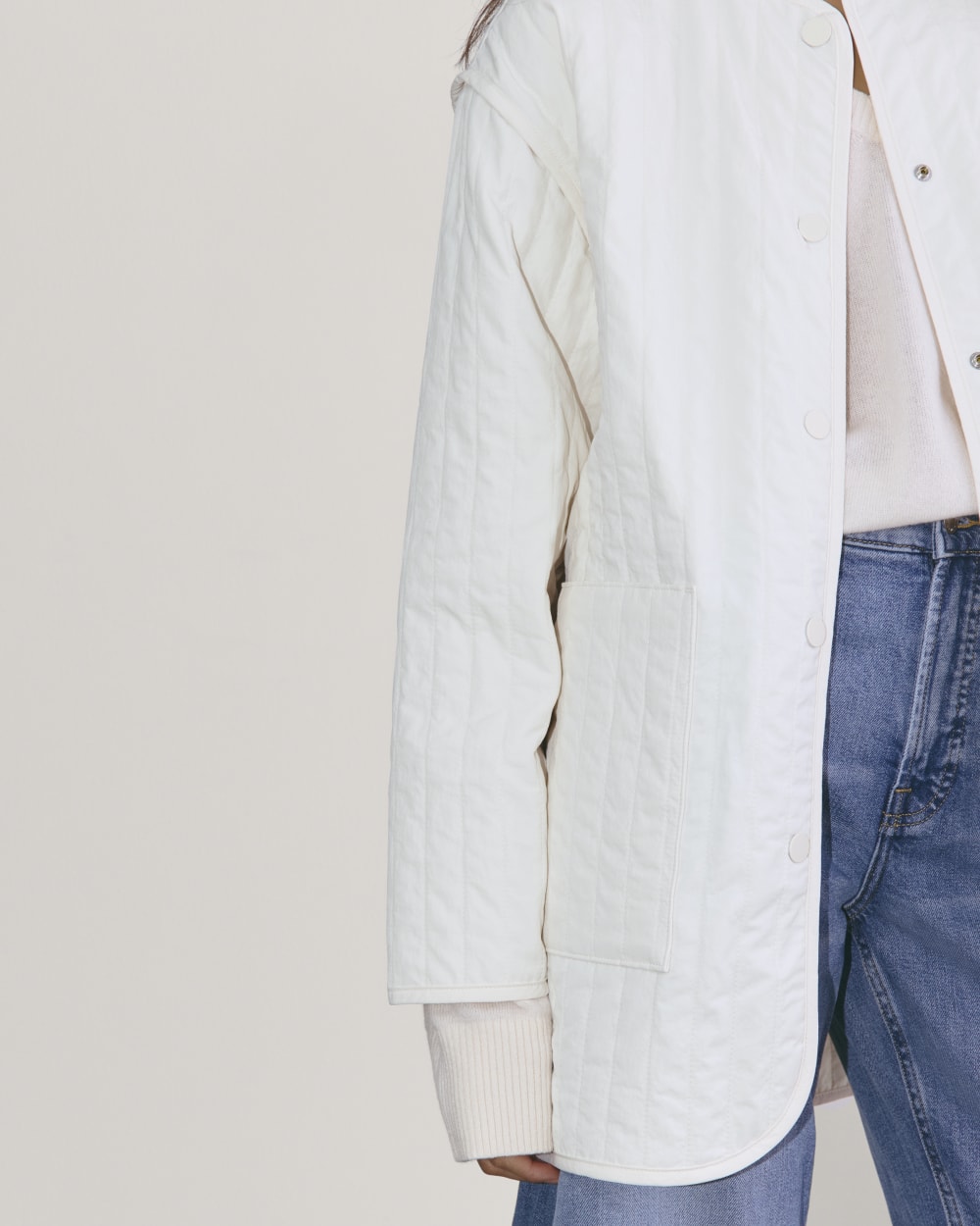The Midi Quilted Liner in Bone — detail view