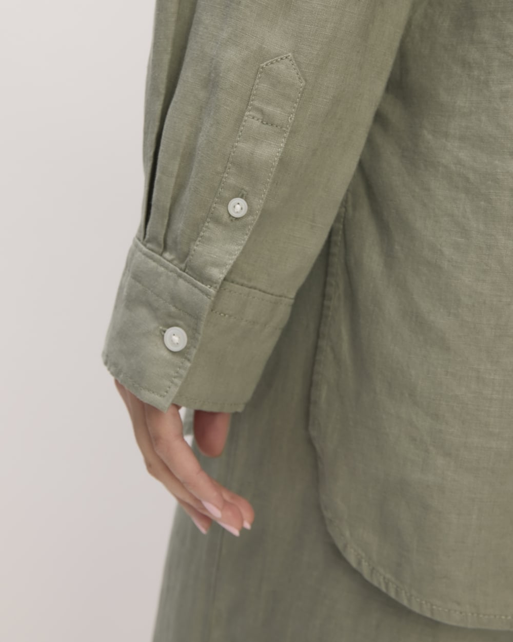 The Boyfriend Shirt in Linen in Sage Green — detail view