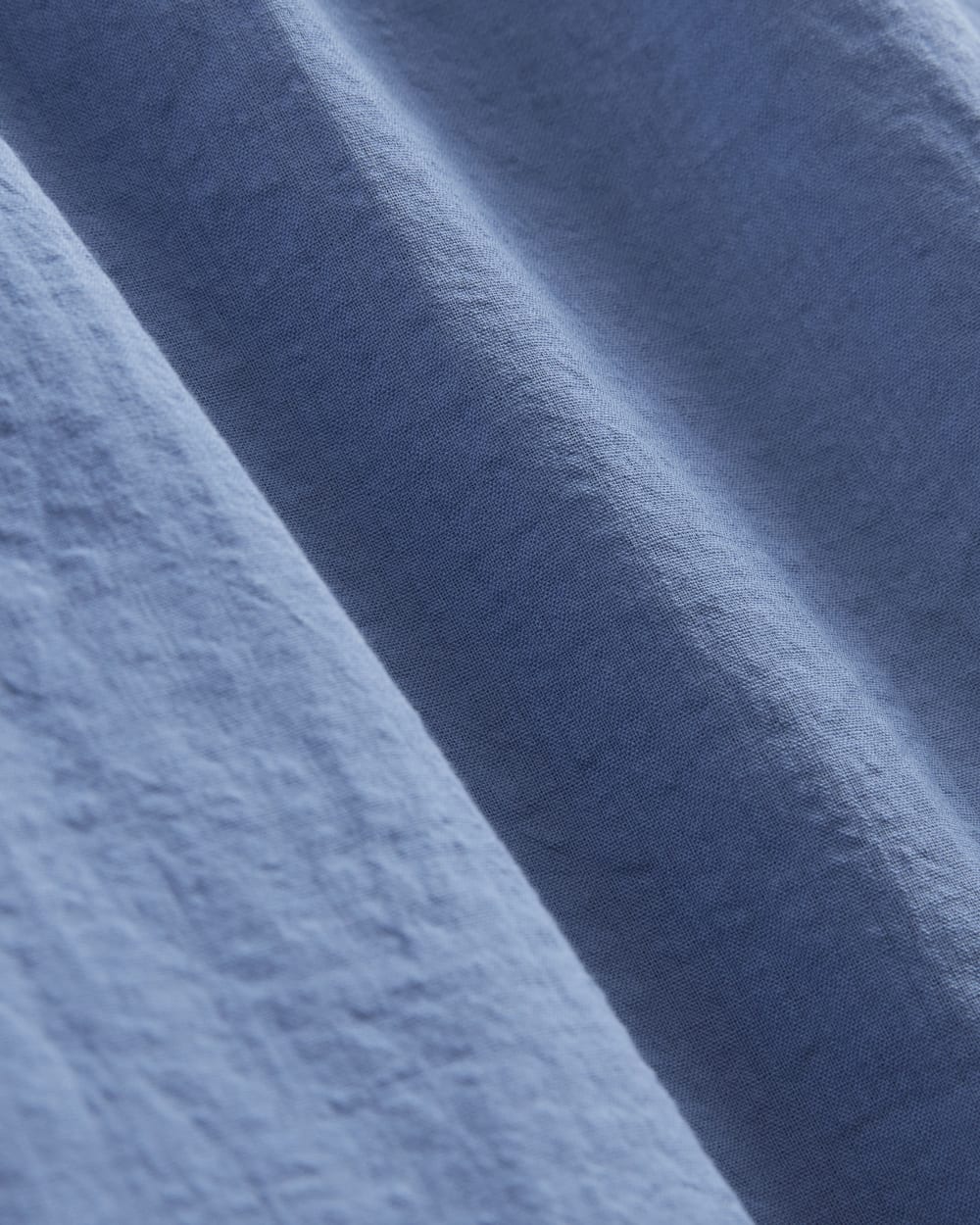 The Gauze Mini Tiered Dress in Soft Cobalt — detail view