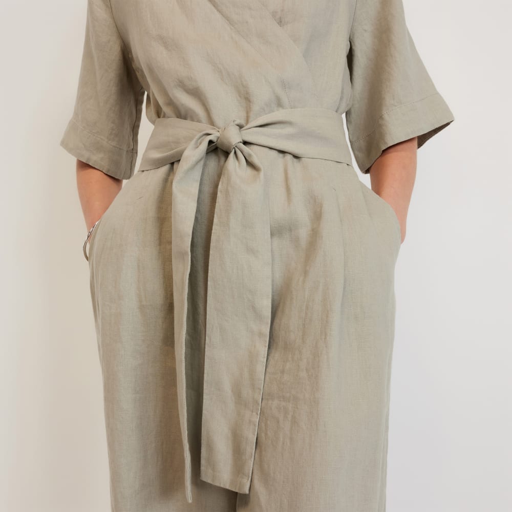 The Wrap Jumpsuit in Linen in Seagrass — detail view