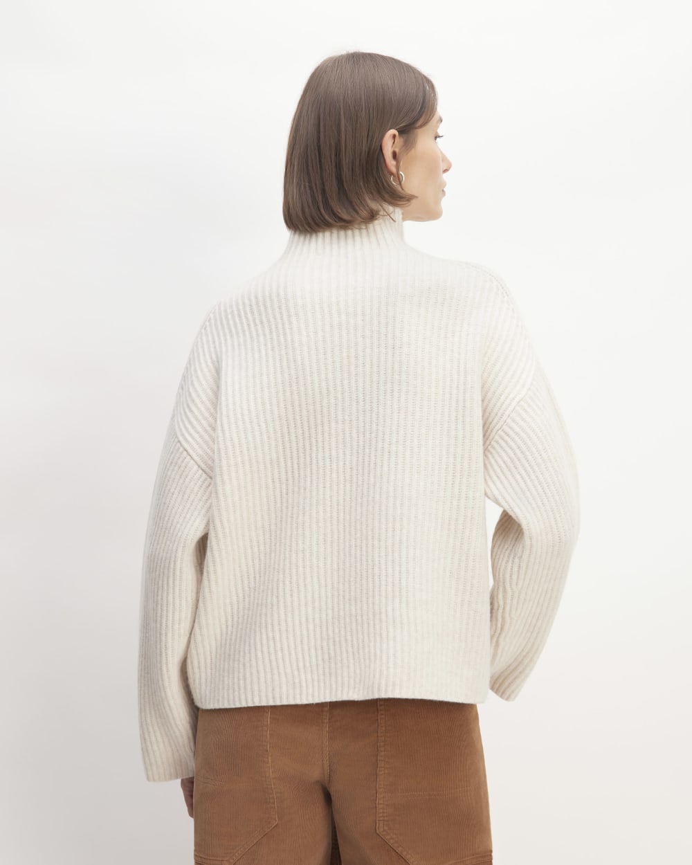 The Felted Merino Funnel-Neck Pullover in Heathered Oat — detail view