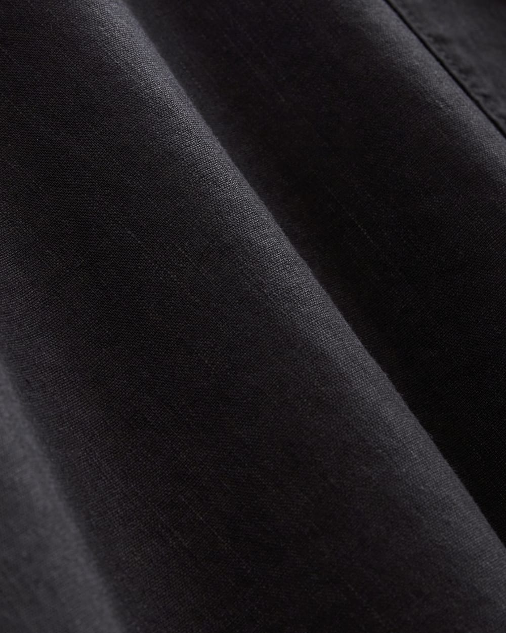 The Seamed Dress in Stretch Linen in Black — detail view