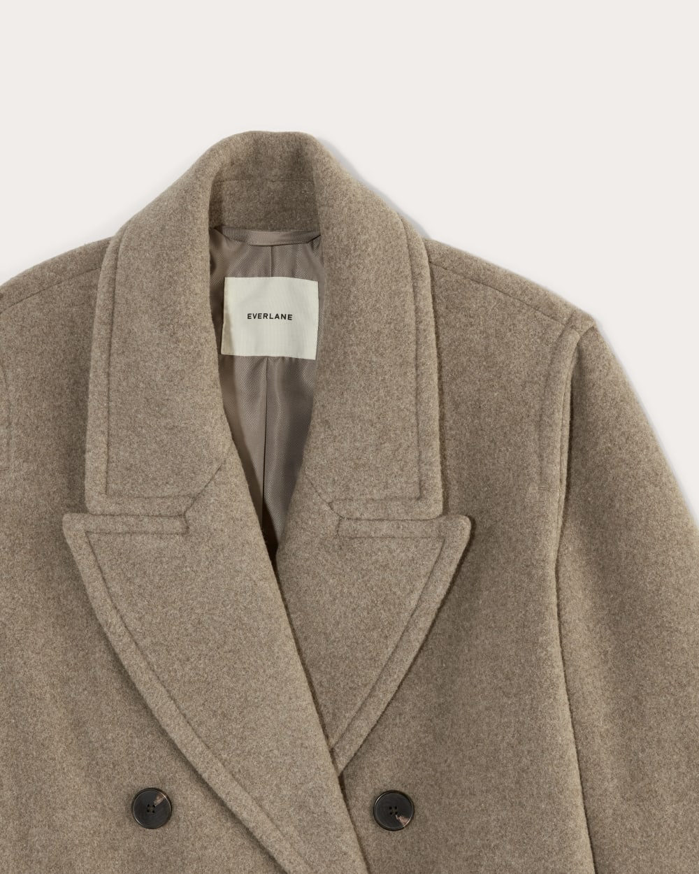 The Double-Breasted Coat in Wool in Heather Taupe — detail view