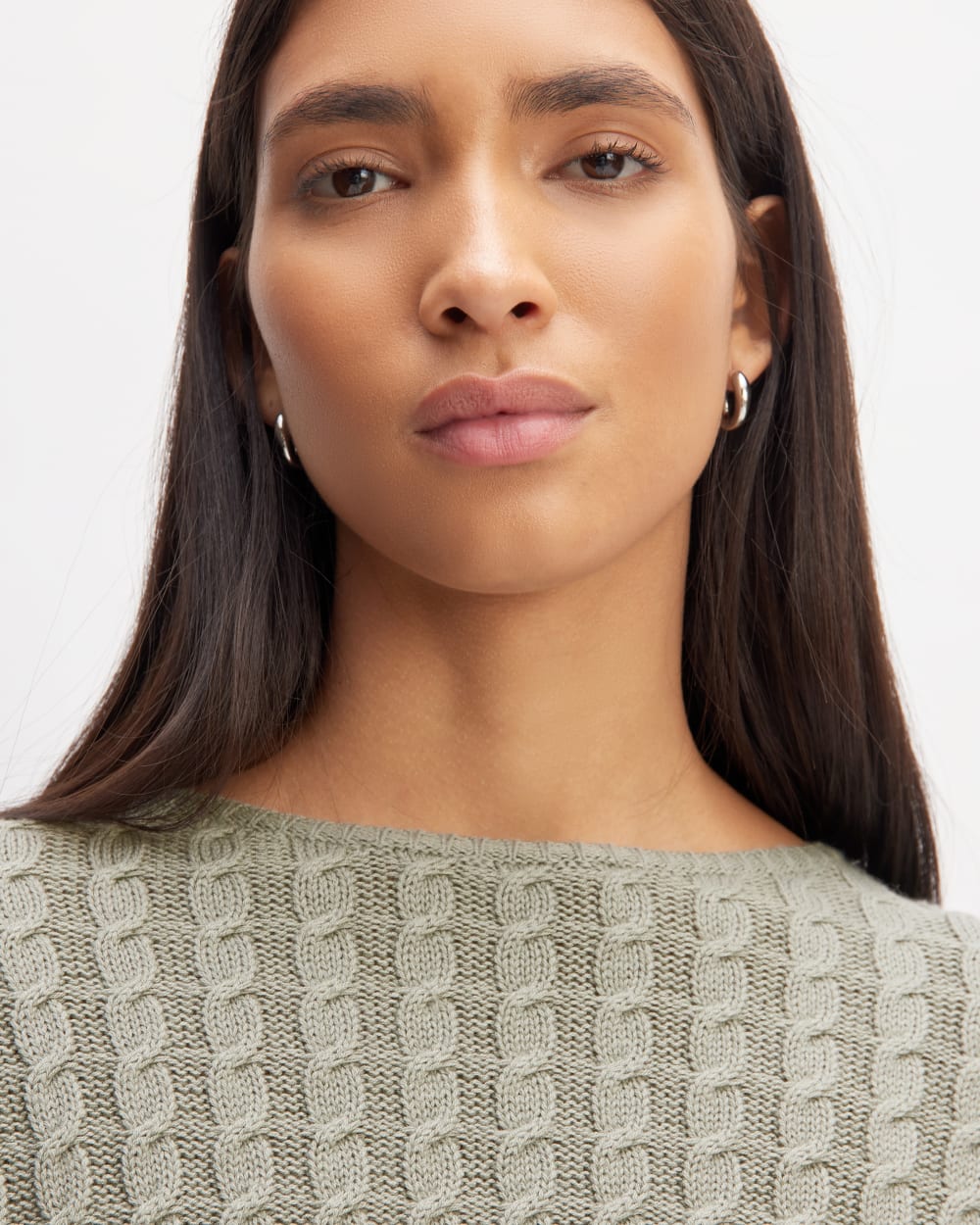 The Cotton Merino Cable Crew in Sage Green — detail view