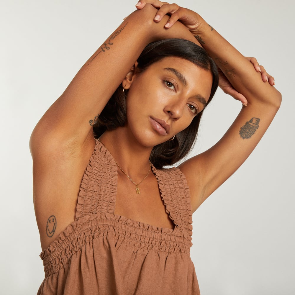 The Smocked Linen Dress in Tawny Brown — detail view