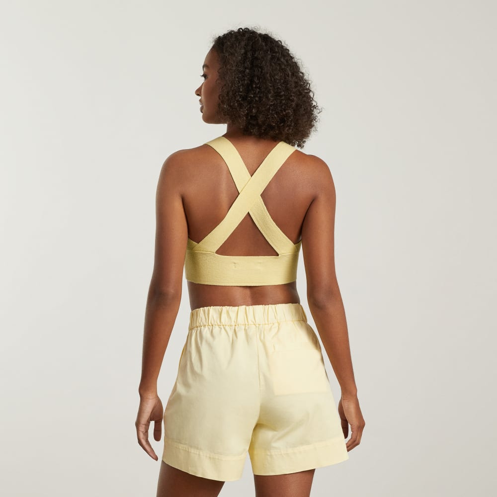 The Cross-Back Cropped Sweater Top in Pastel Yellow — detail view