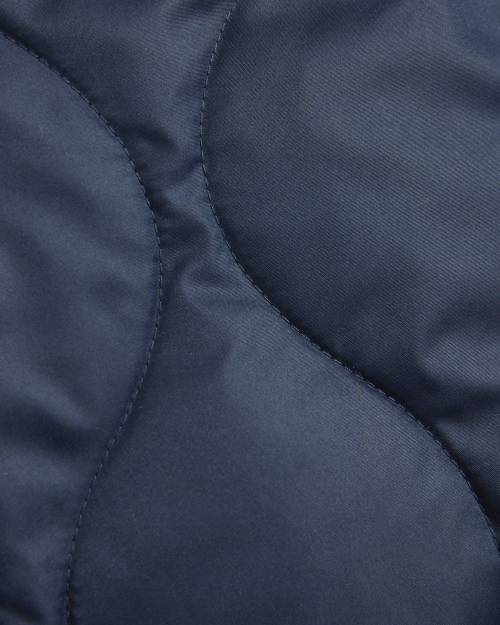 The Quilted Liner in Navy — detail view