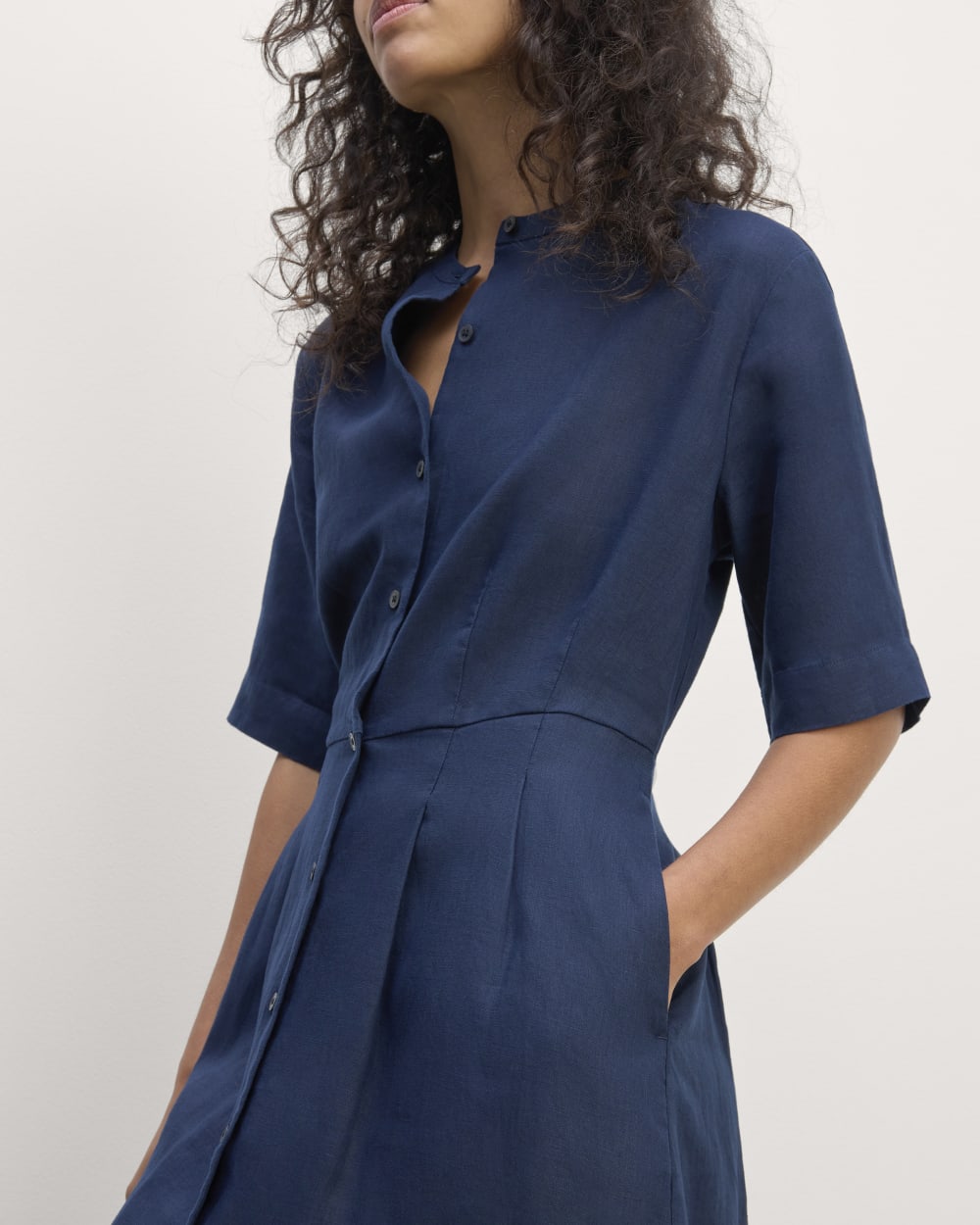 The Frolic Dress in Linen in Navy — detail view