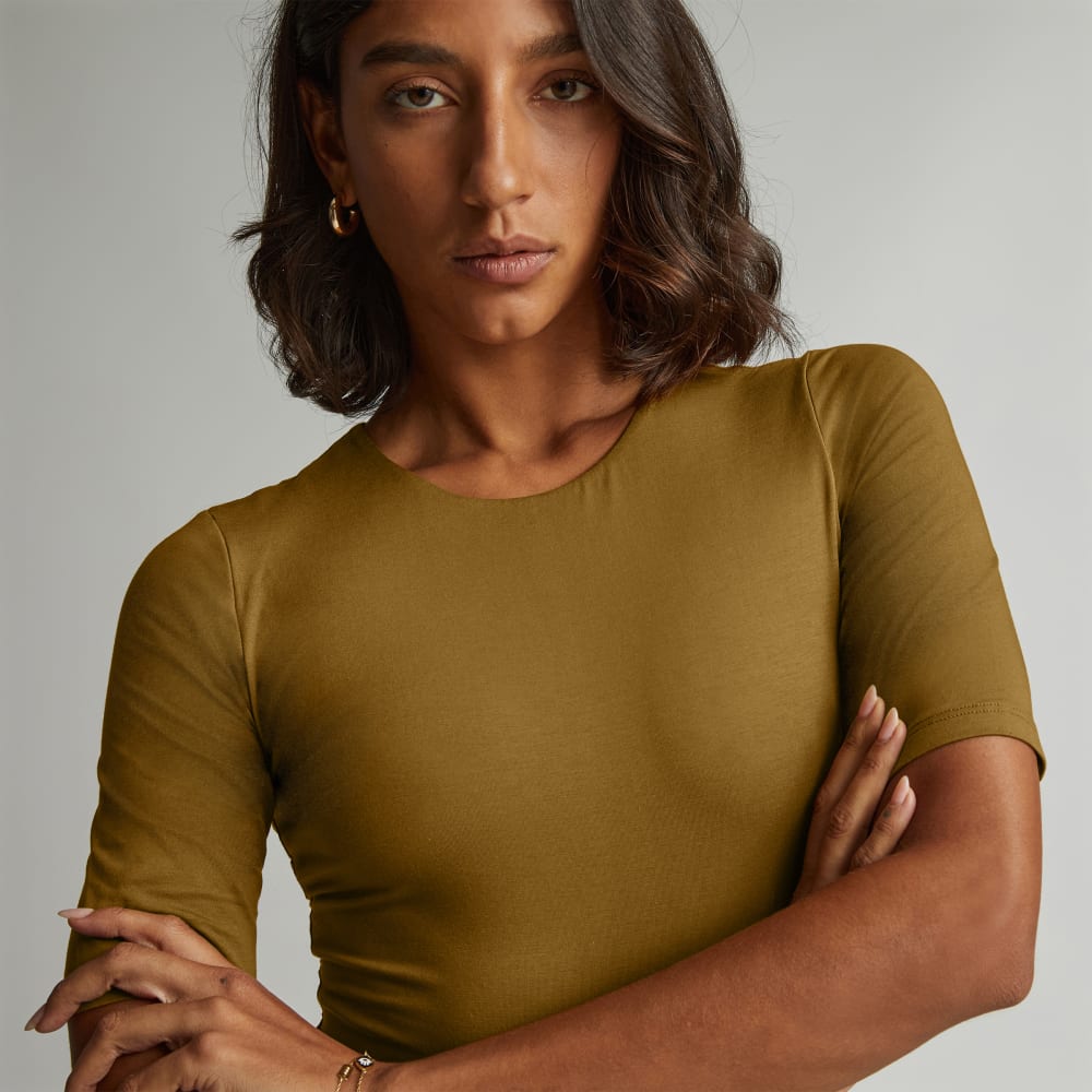 The Short-Sleeve Crew Neck Bodysuit in Tapenade — detail view