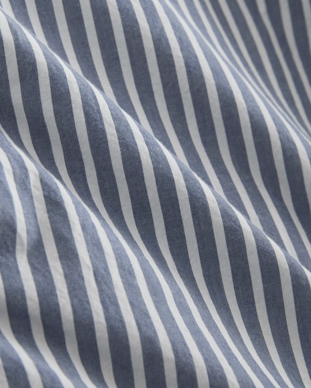 The Relaxed Shirt Dress in Ultrasoft Cotton in Bone / Mazarine Blue — detail view