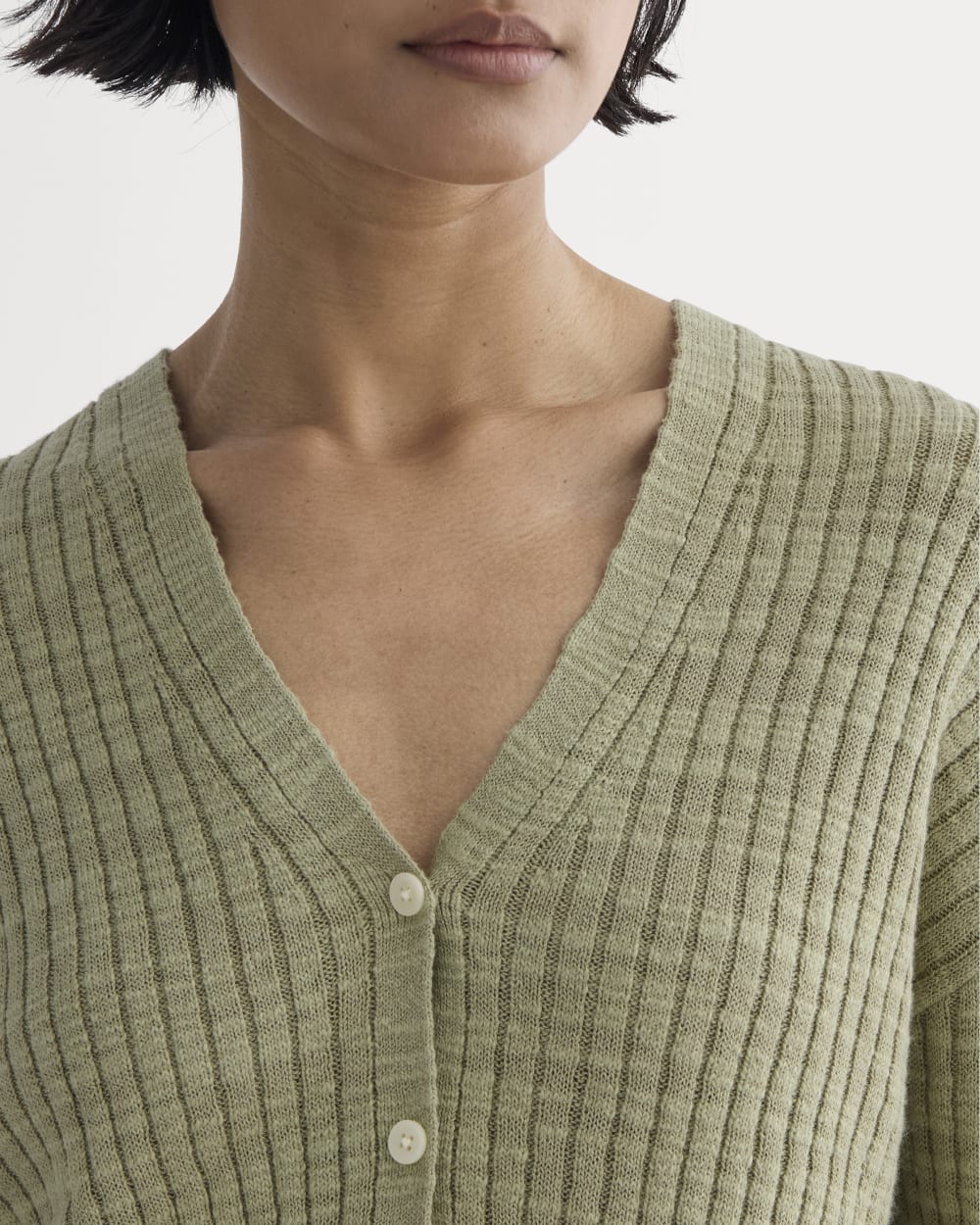 The Ribbed Cardigan in Cotton Linen in Eucalyptus — detail view
